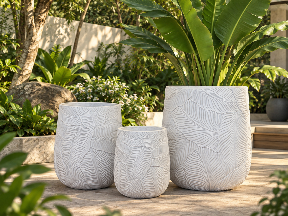 White lightweight drum planter with embossed banana leaf texture